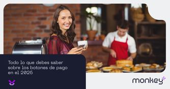 Todo lo que debes saber sobre los botones de pago en el 2026 Mujer sonriendo en una cafetería usando su celular para pagos