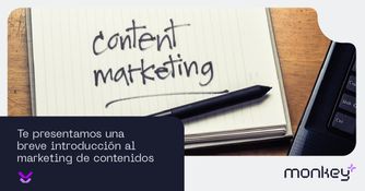 Introducción al marketing de contenidos Cuaderno con la frase content marketing y bolígrafo junto a un teclado